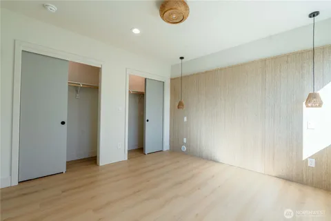 a bathroom with a double vanity sink toilet and a mirror