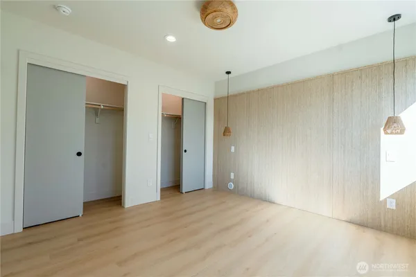 a bathroom with a double vanity sink toilet and a mirror