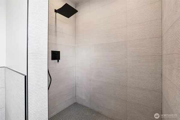 a bathroom with a sink a mirror a toilet and a bathtub