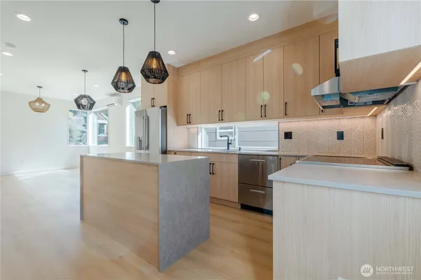 a kitchen with cabinets and window