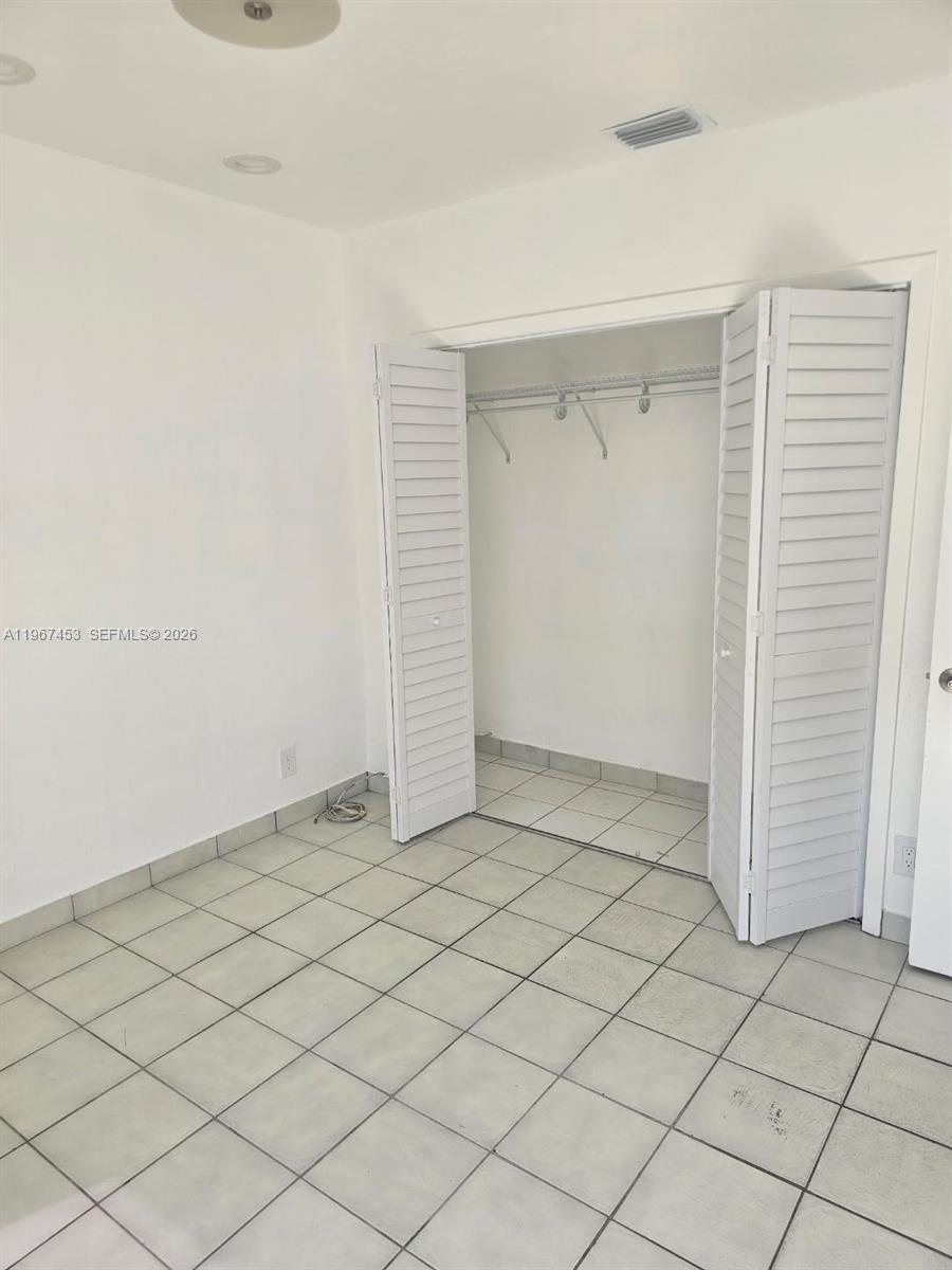 3475 Southwest 1st Avenue, Unit 14 Miami, FL 33145 - Photo 15 of 22 an empty room with cabinet