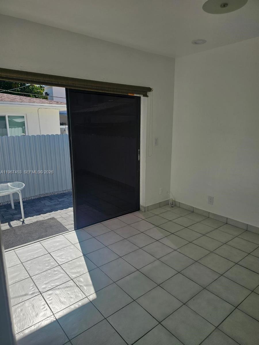 3475 Southwest 1st Avenue, Unit 14 Miami, FL 33145 - Photo 16 of 22 a view of an empty room and wooden floor