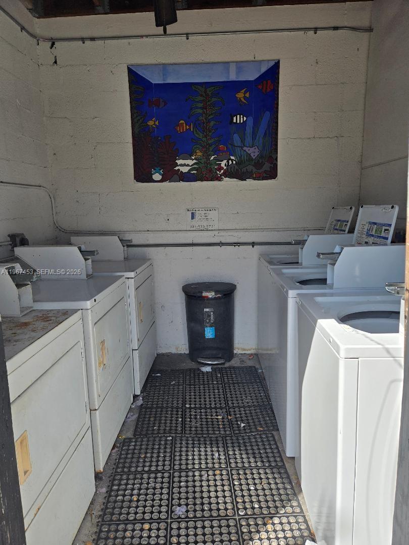3475 Southwest 1st Avenue, Unit 14 Miami, FL 33145 - Photo 19 of 22 a utility room with dryer and washer