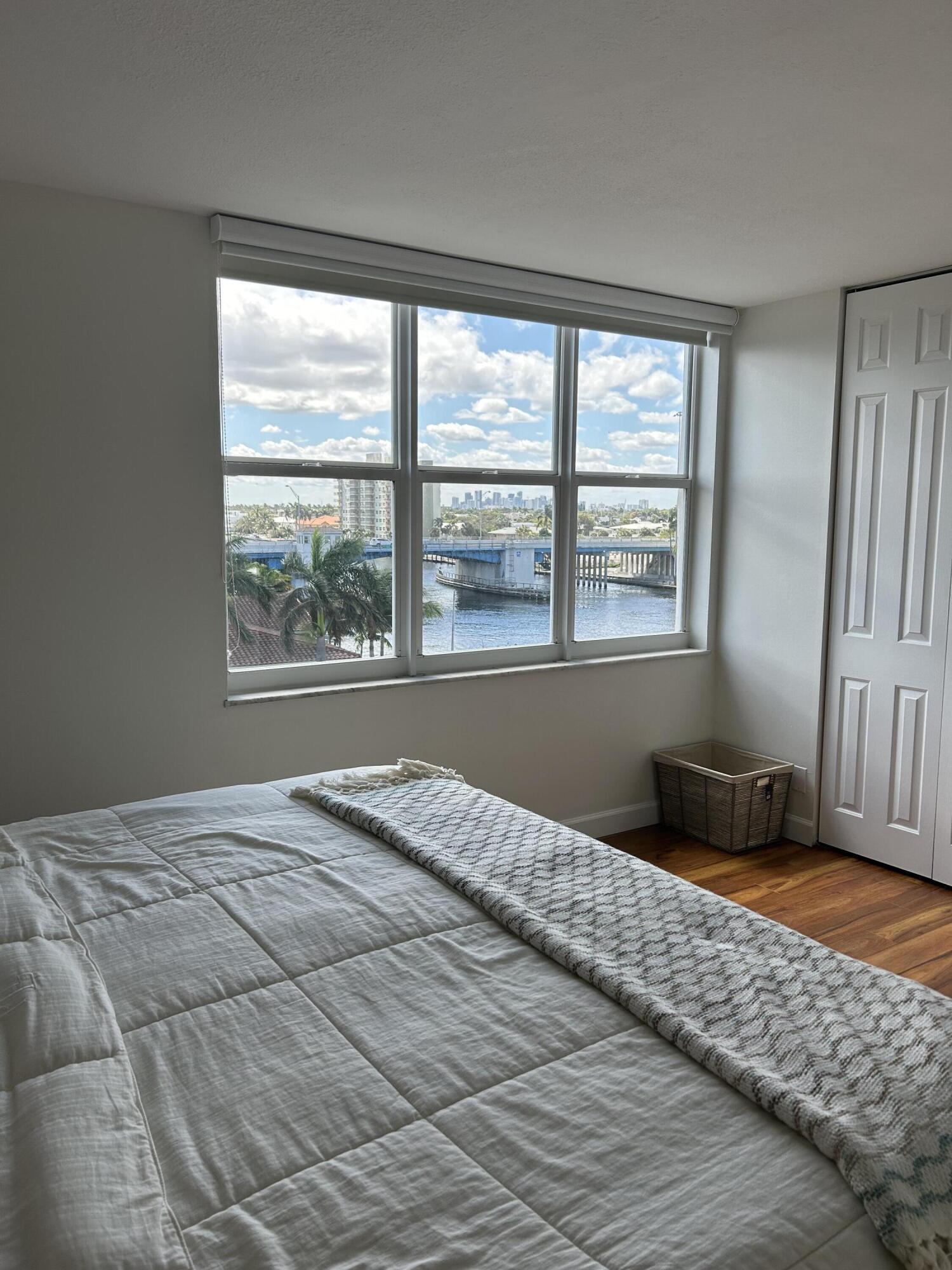 3233 Northeast 32nd Avenue, Unit 503 Fort Lauderdale, FL 33308 - Photo 10 of 15 a bedroom with a bed and a window