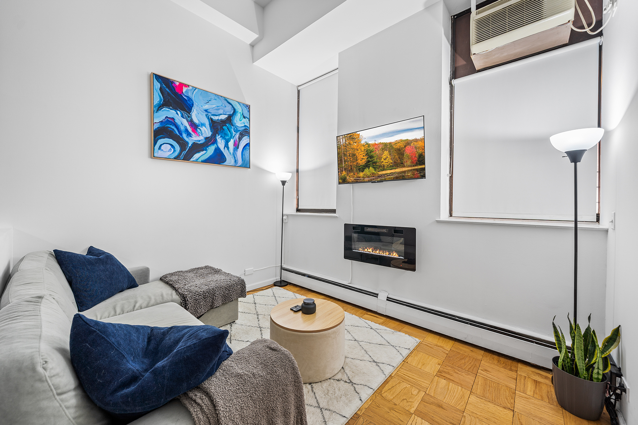 a living room with furniture and a flat screen tv