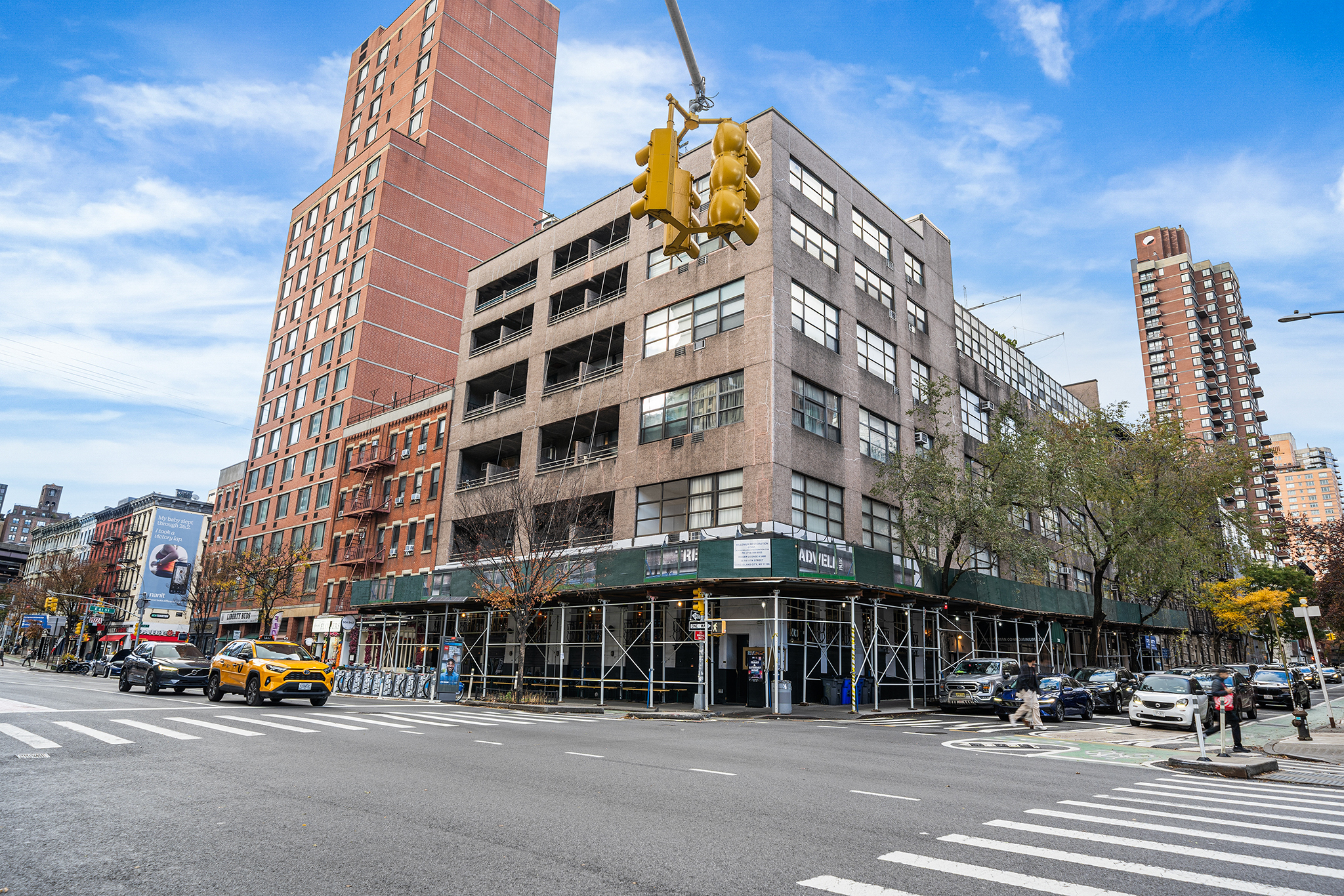 350 East 62nd Street, Unit 1M Manhattan, NY 10065 - Photo 2 of 18 a front view of a building and a street
