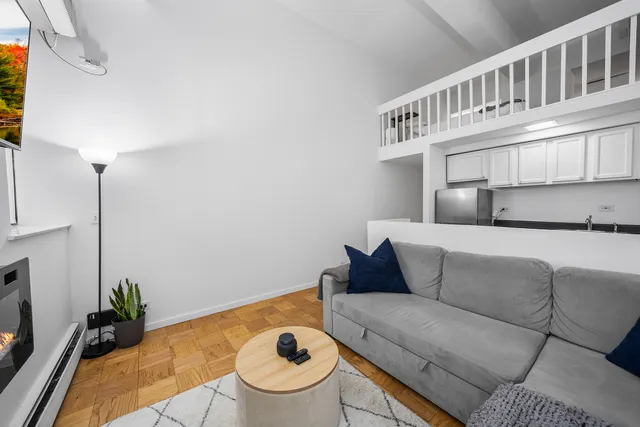 a living room with furniture and a table