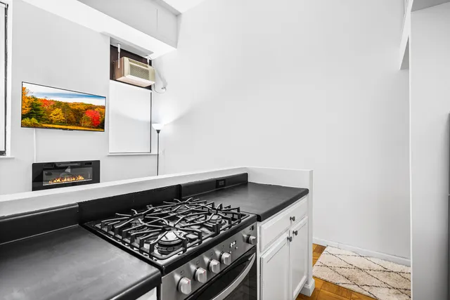 a kitchen with a stove and a microwave