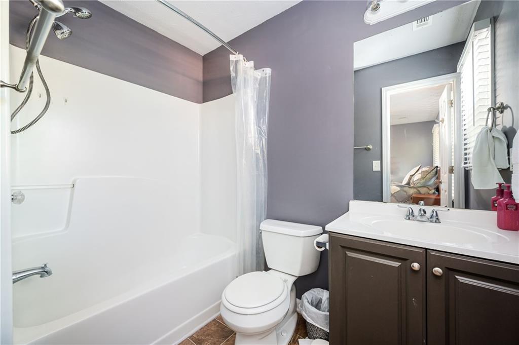 70 Countryside Lane Covington, GA 30016 - Photo 19 of 30 a bathroom with a sink mirror vanity and toilet