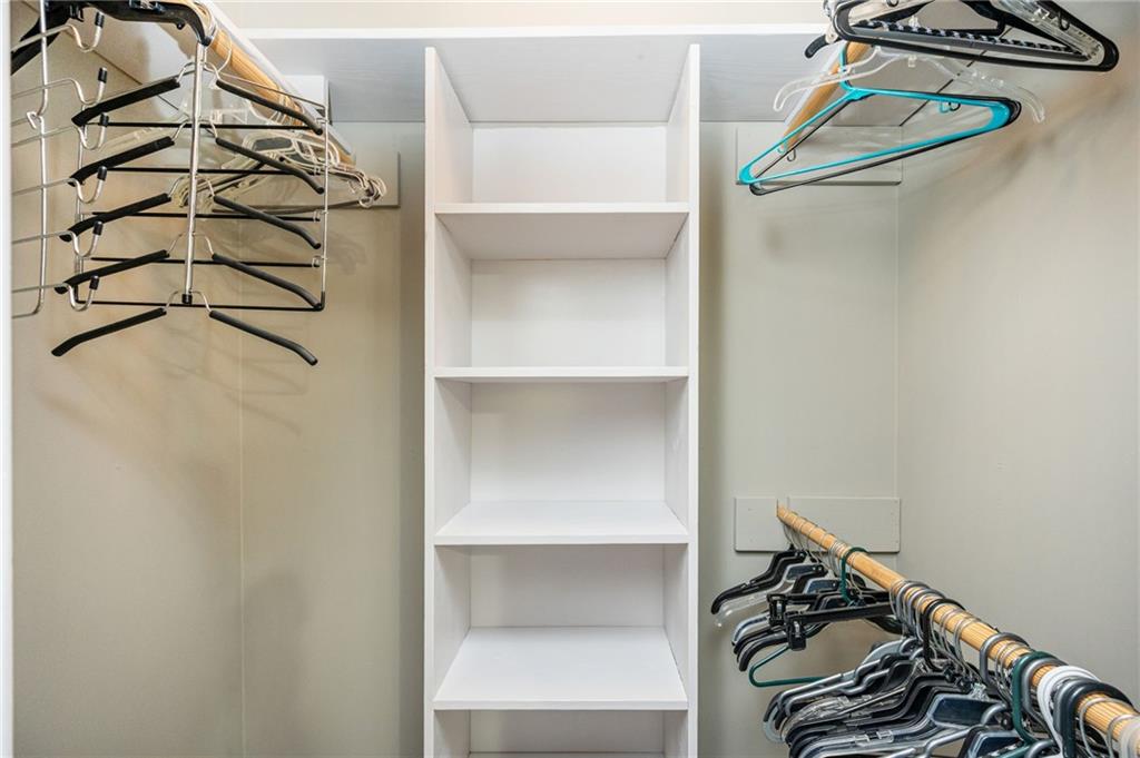 70 Countryside Lane Covington, GA 30016 - Photo 20 of 30 a view of walk in closet with clothes and shoes