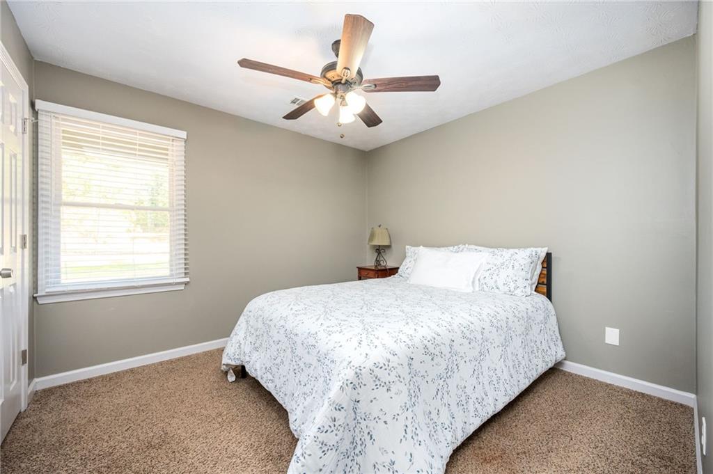 70 Countryside Lane Covington, GA 30016 - Photo 21 of 30 a bedroom with a bed and window