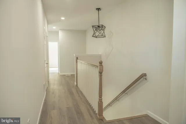 a view of a hallway with stairs