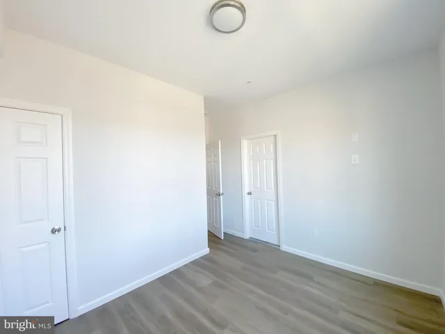 a view of a kitchen with wooden floor
