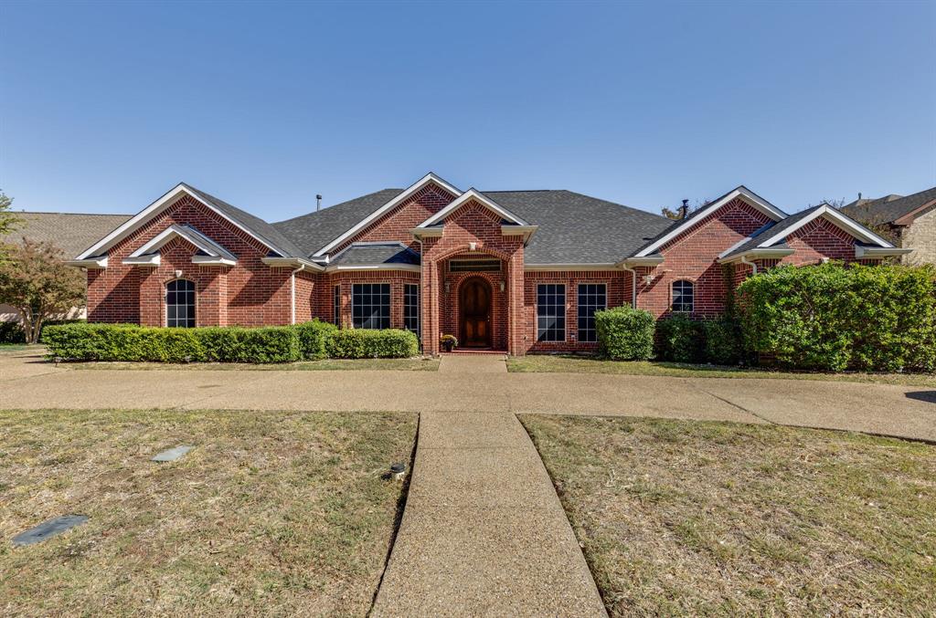 4128 Las Brisas Drive Irving, TX 75038 - Photo 1 of 1 front view of a house with a yard