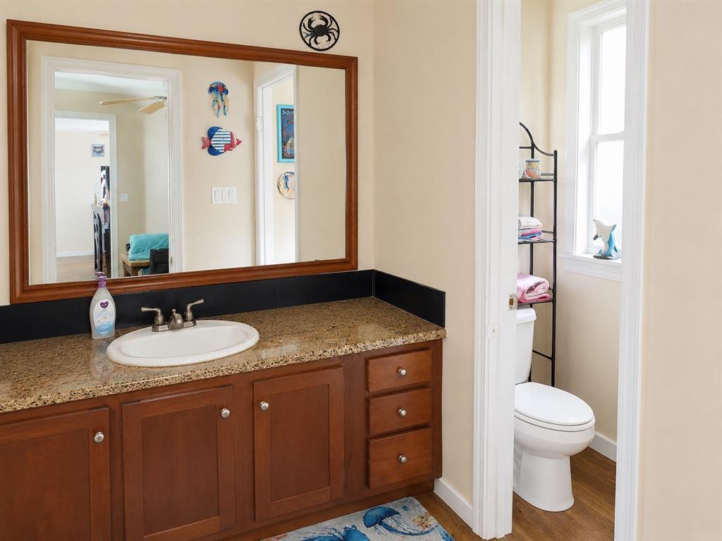 2900 Interstate 35, Unit 80 Waco, TX 76706 - Photo 6 of 10 a bathroom with a granite countertop sink and a mirror