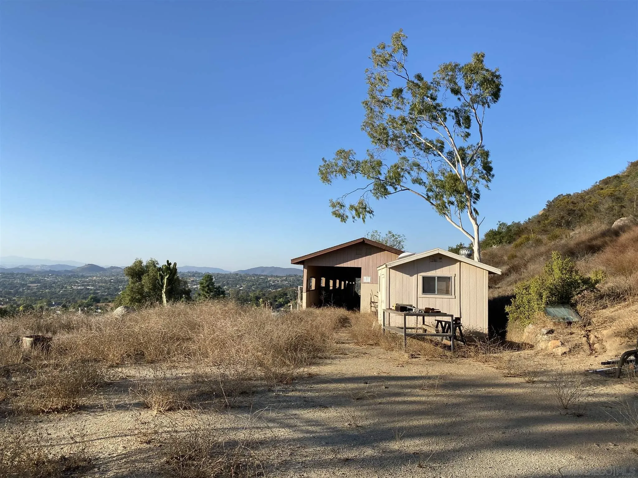 30550 Miller Road Valley Center, CA 92082 - Photo 11 of 23 a white house with a big yard and large trees