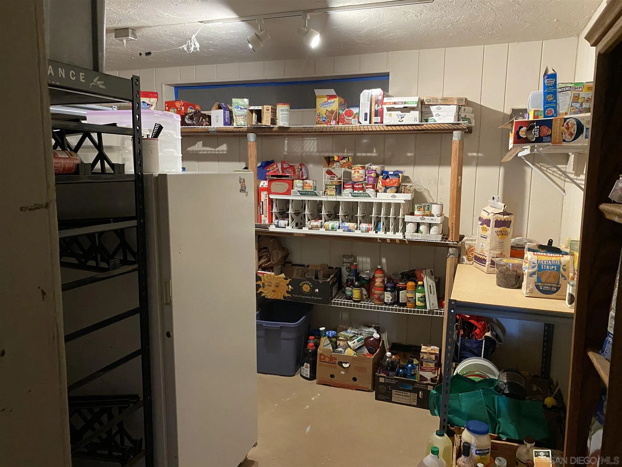 30550 Miller Road Valley Center, CA 92082 - Photo 7 of 23 a room with lots of different colored cloths