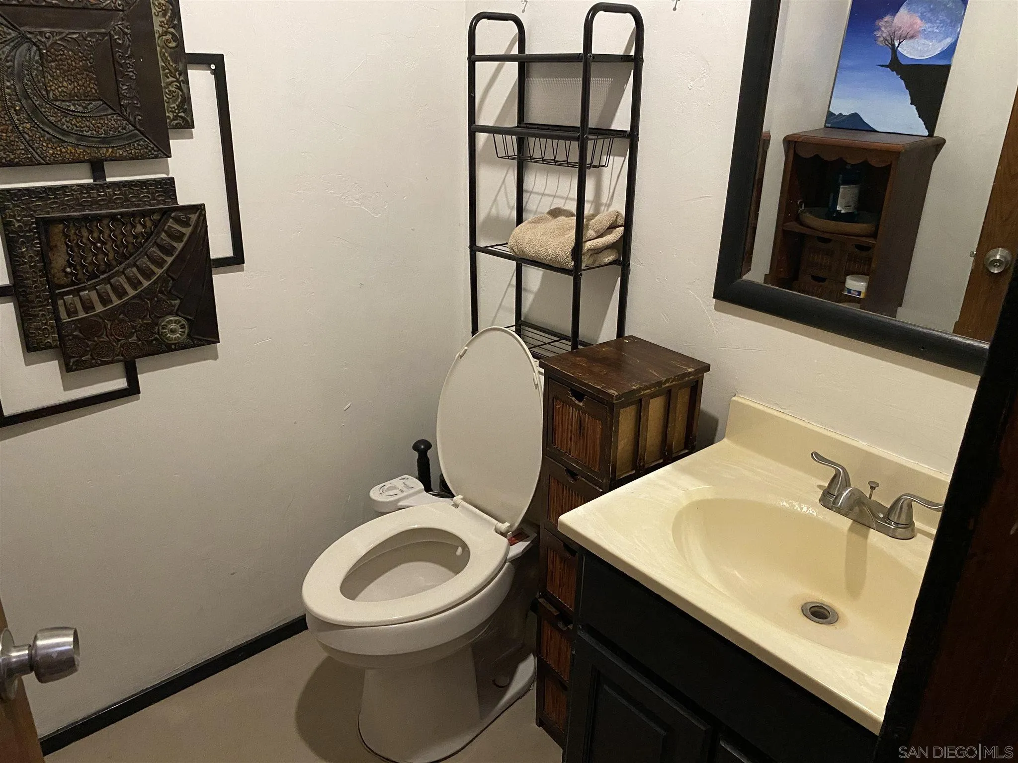 30550 Miller Road Valley Center, CA 92082 - Photo 10 of 23 a bathroom with a toilet sink and mirror