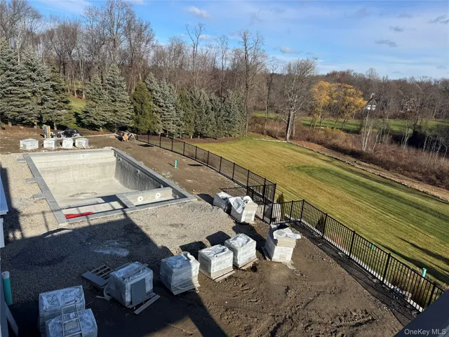 a view of a terrace with couches and wooden floor