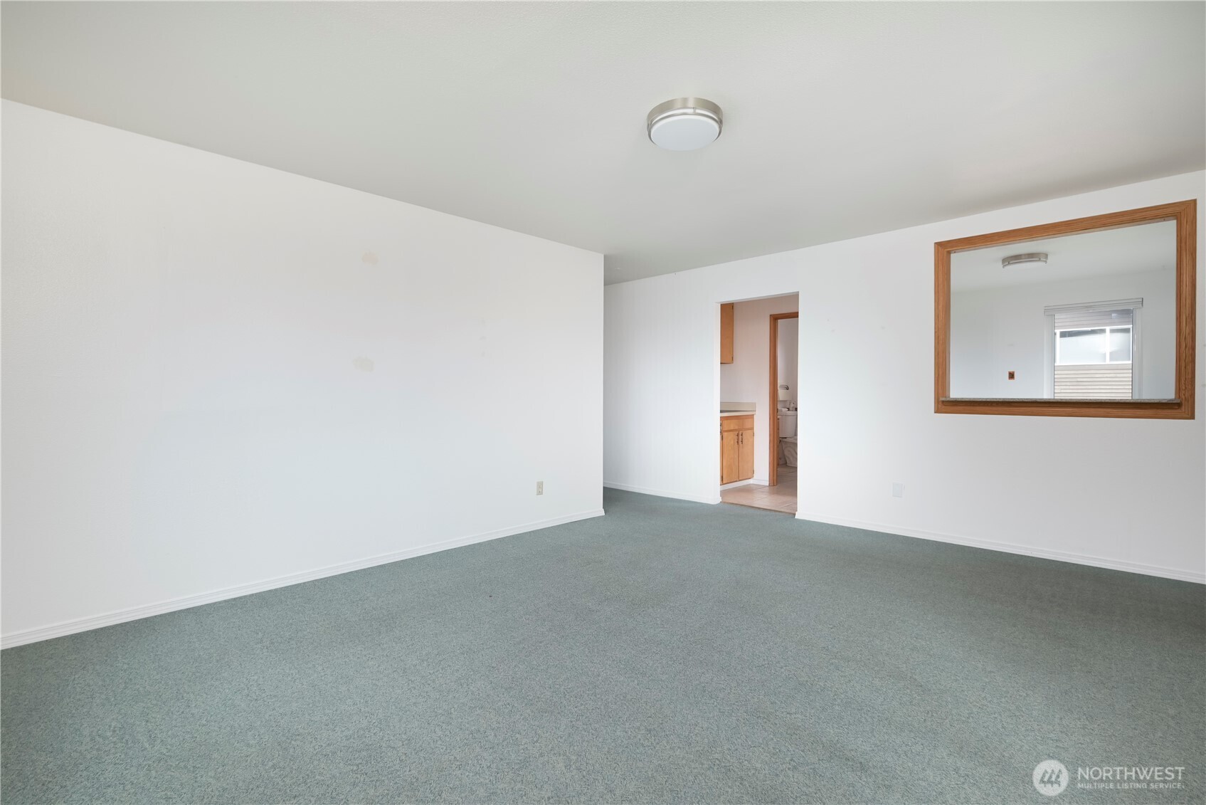 1121 Southeast Dock Street Oak Harbor, WA 98277 - Photo 11 of 28 a view of an empty room with a window