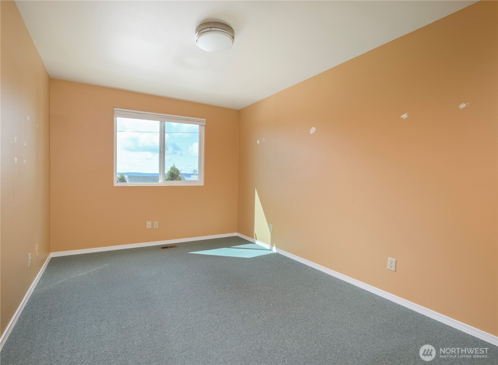 1121 Southeast Dock Street Oak Harbor, WA 98277 - Photo 15 of 28 an empty room with windows