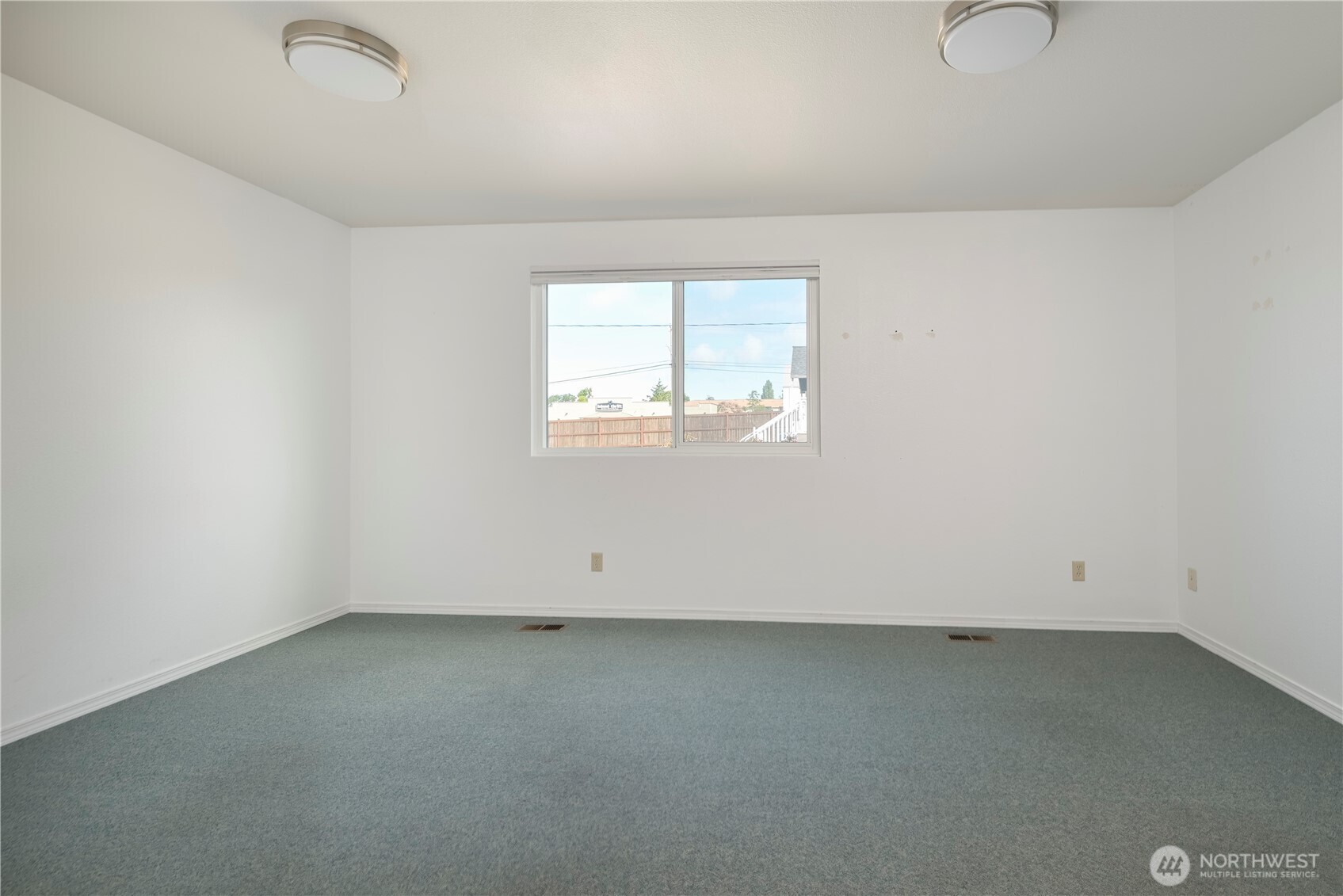 1121 Southeast Dock Street Oak Harbor, WA 98277 - Photo 17 of 28 an empty room with a window