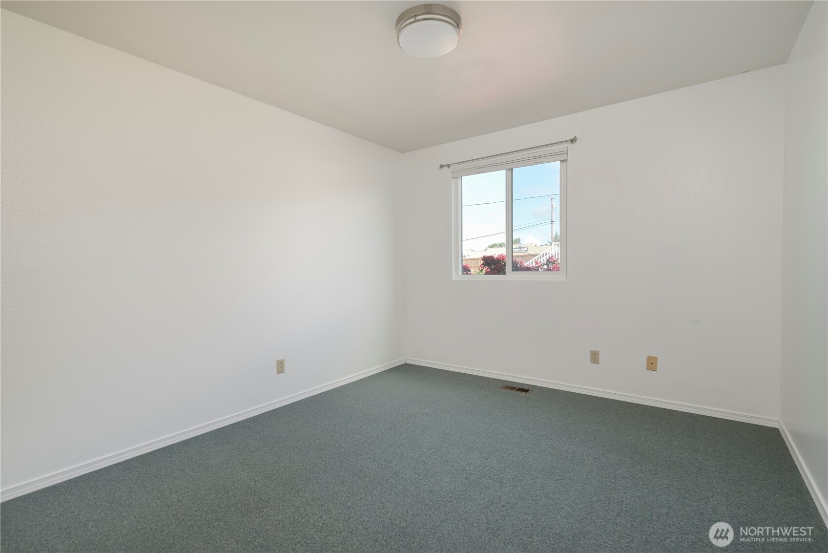 1121 Southeast Dock Street Oak Harbor, WA 98277 - Photo 18 of 28 an empty room with a window
