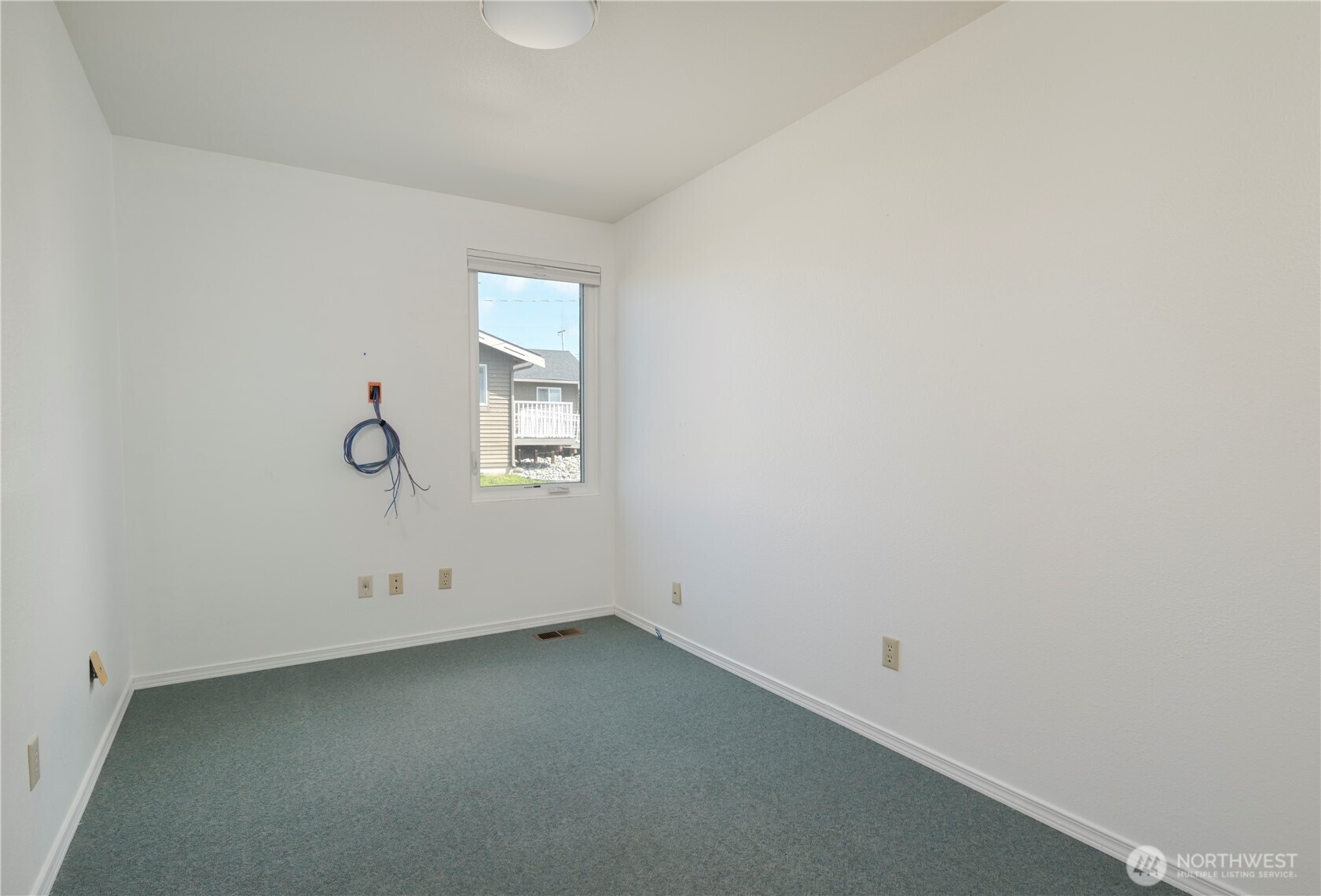 1121 Southeast Dock Street Oak Harbor, WA 98277 - Photo 19 of 28 an empty room with windows