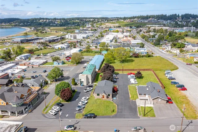 an aerial view of residential houses with outdoor space