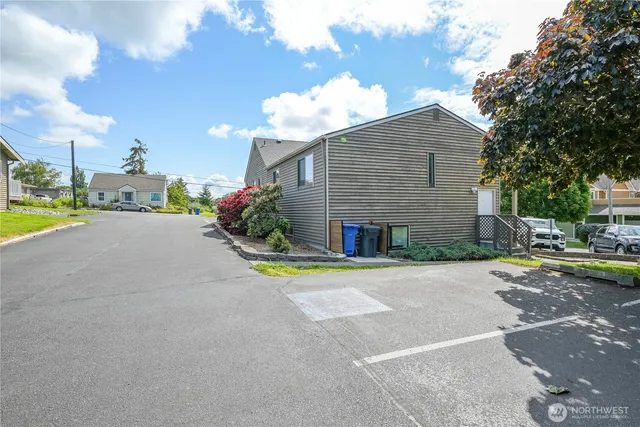 a view of a house with a yard and sitting area