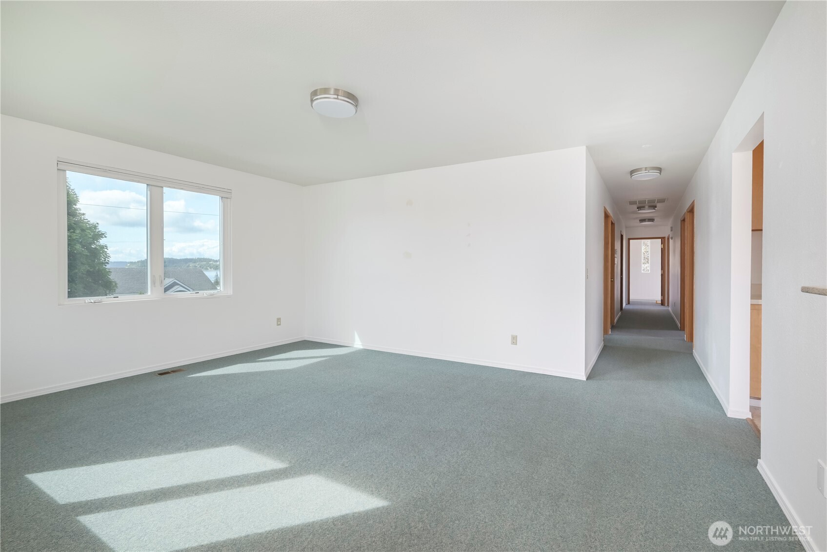 1121 Southeast Dock Street Oak Harbor, WA 98277 - Photo 7 of 28 an empty room with windows