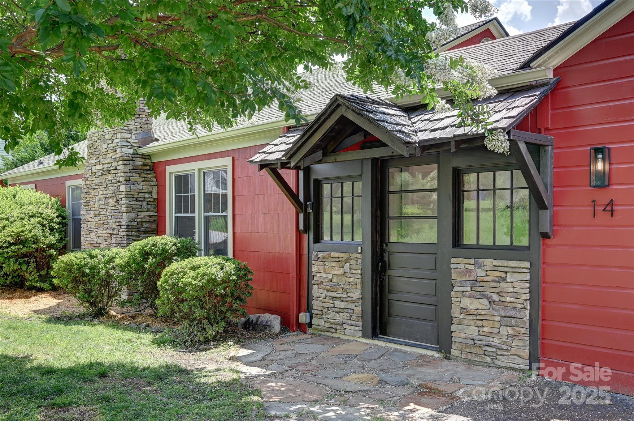 14 Monroe Street Brevard, NC 28712 - Photo 1 of 48 a front view of a house with garden