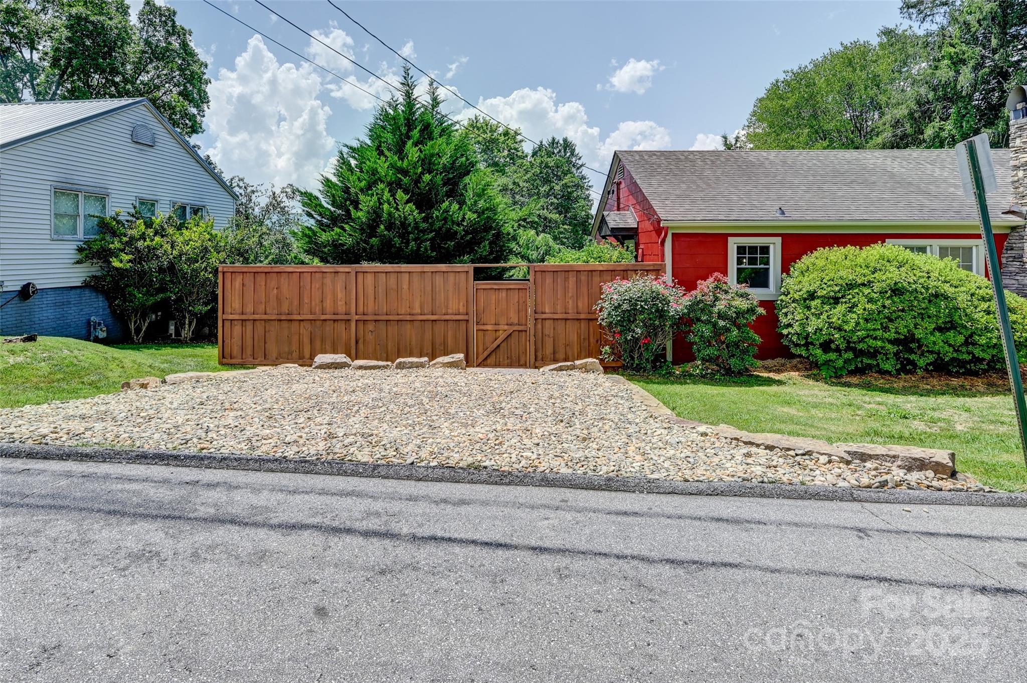 14 Monroe Street Brevard, NC 28712 - Photo 12 of 48 a view of a house with a yard and large tree