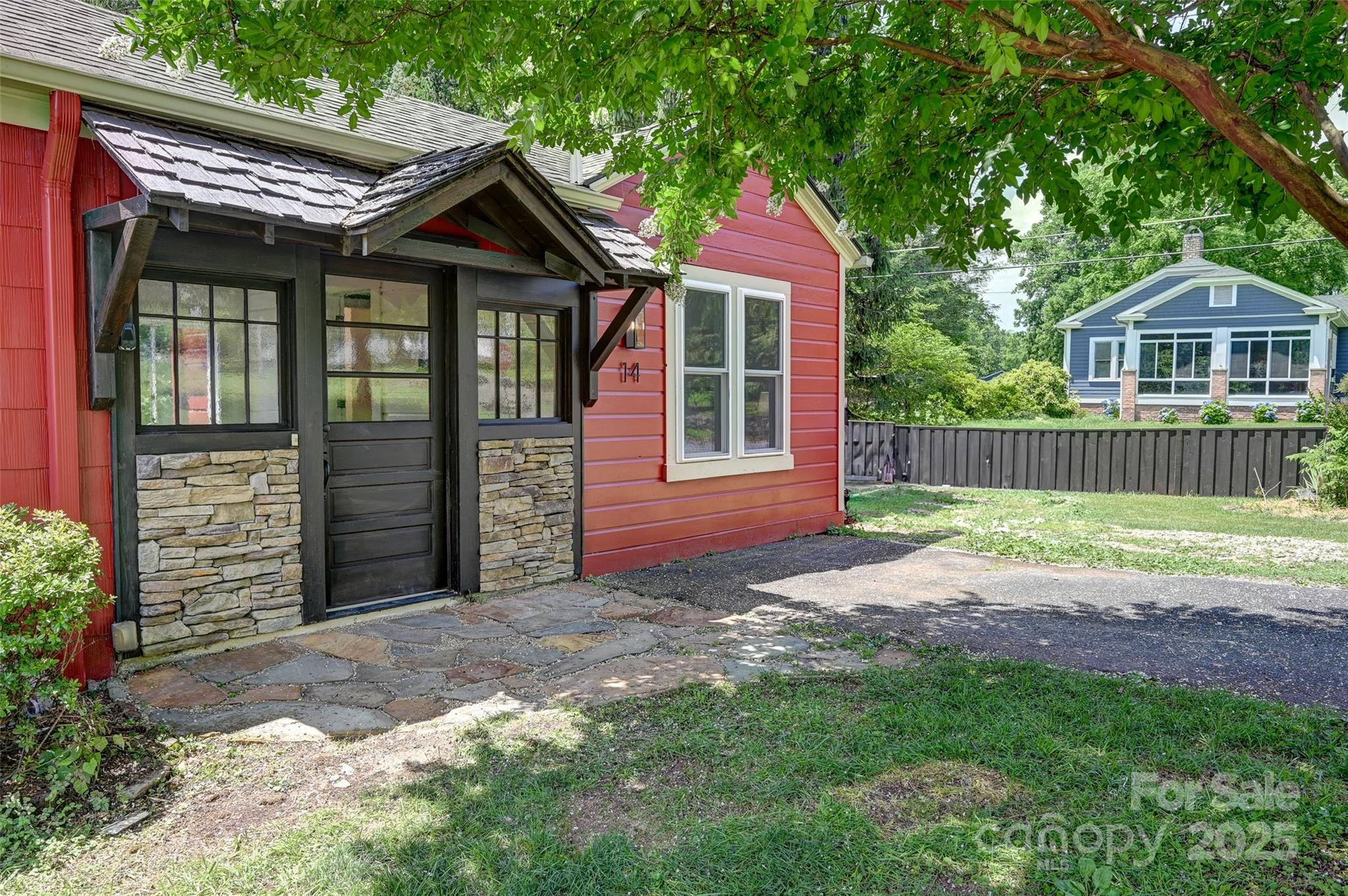 14 Monroe Street Brevard, NC 28712 - Photo 13 of 48 a front view of a house with garden