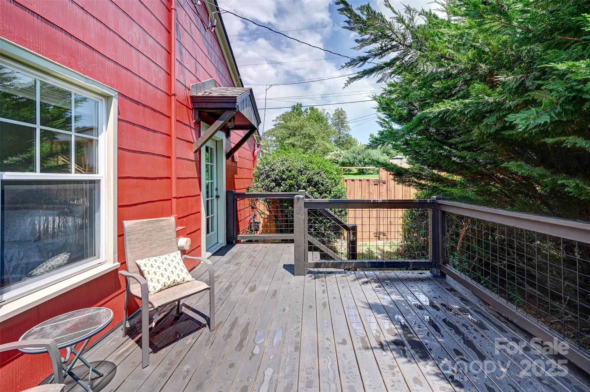14 Monroe Street Brevard, NC 28712 - Photo 16 of 48 a view of balcony with wooden floor and outdoor seating