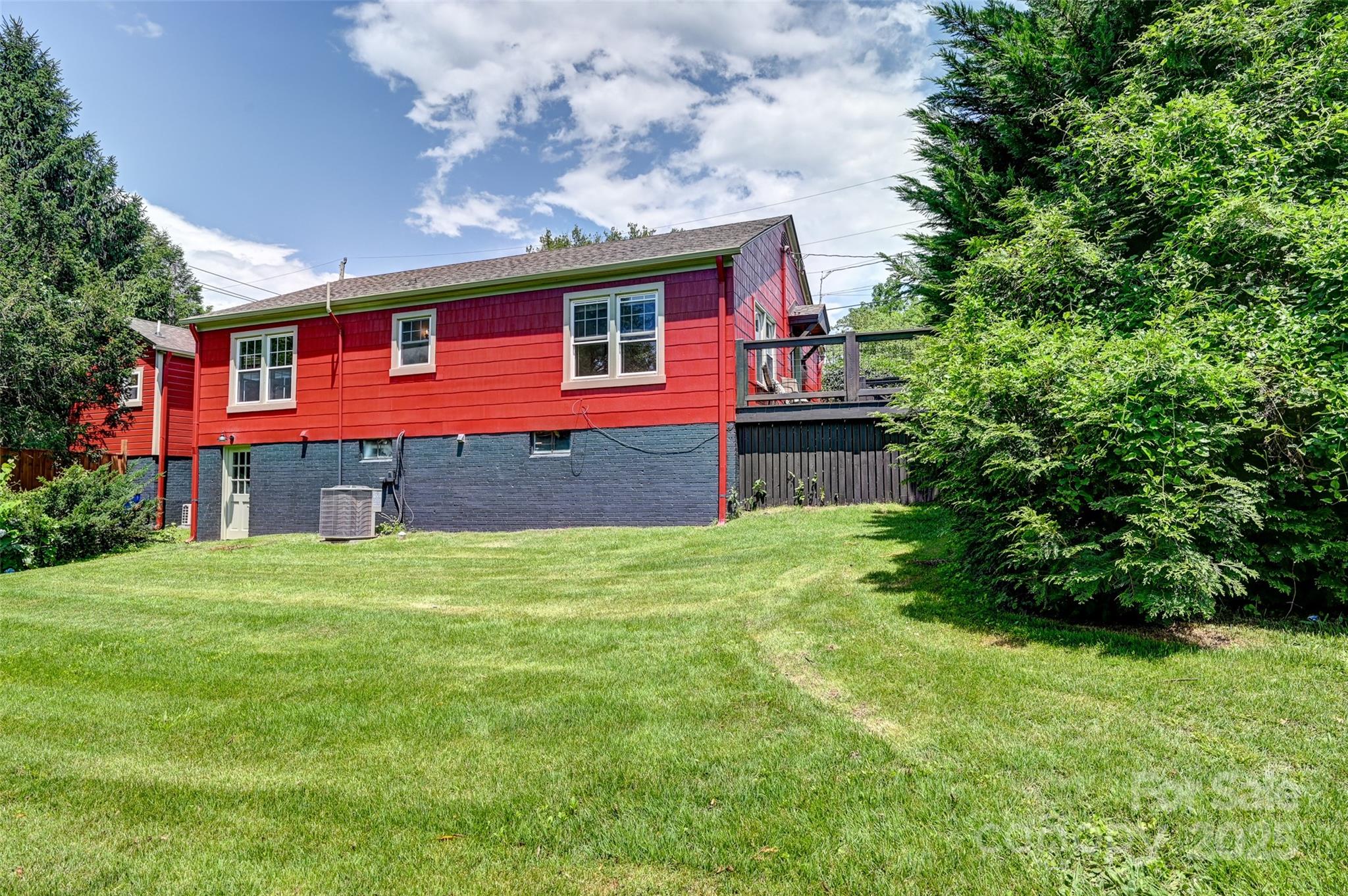 14 Monroe Street Brevard, NC 28712 - Photo 19 of 48 a front view of a house with a garden