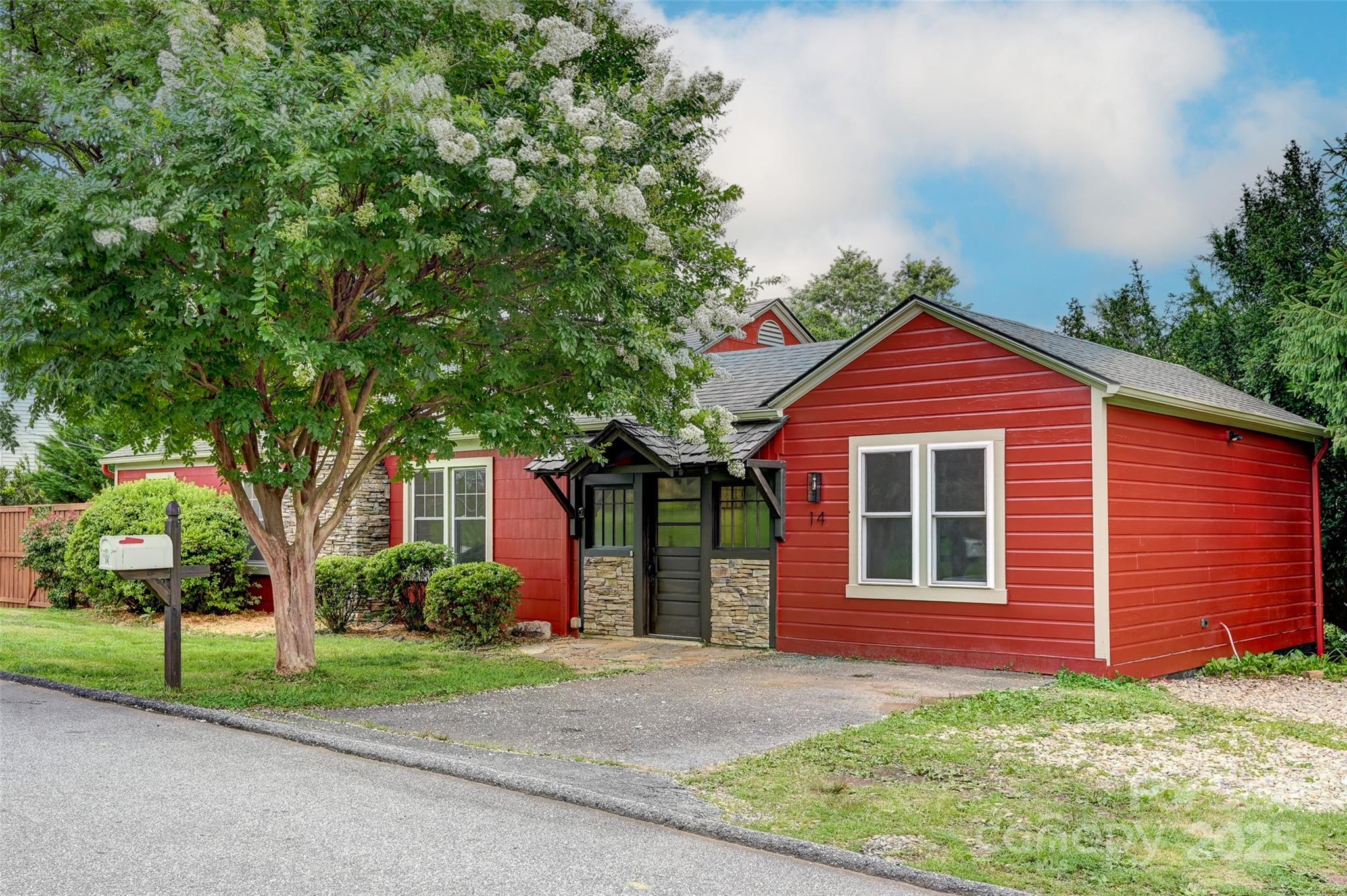 14 Monroe Street Brevard, NC 28712 - Photo 2 of 48 a front view of a house with garden