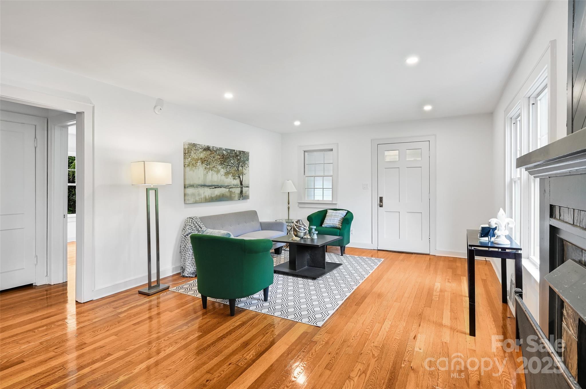 14 Monroe Street Brevard, NC 28712 - Photo 31 of 48 a living room with furniture and a wooden floor
