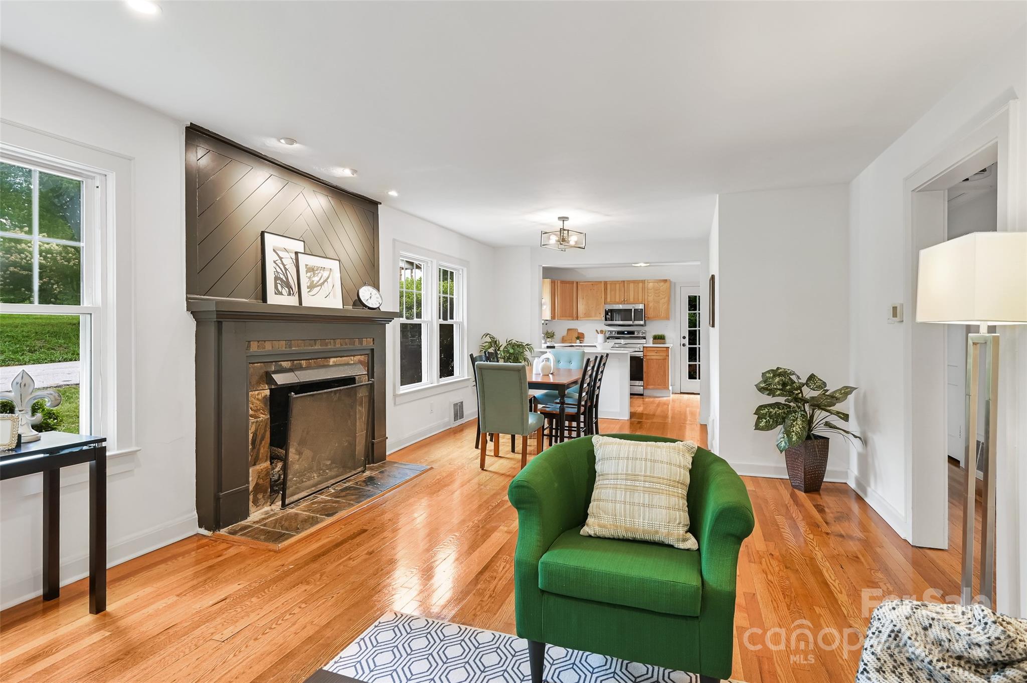 14 Monroe Street Brevard, NC 28712 - Photo 32 of 48 a living room with furniture and a fireplace