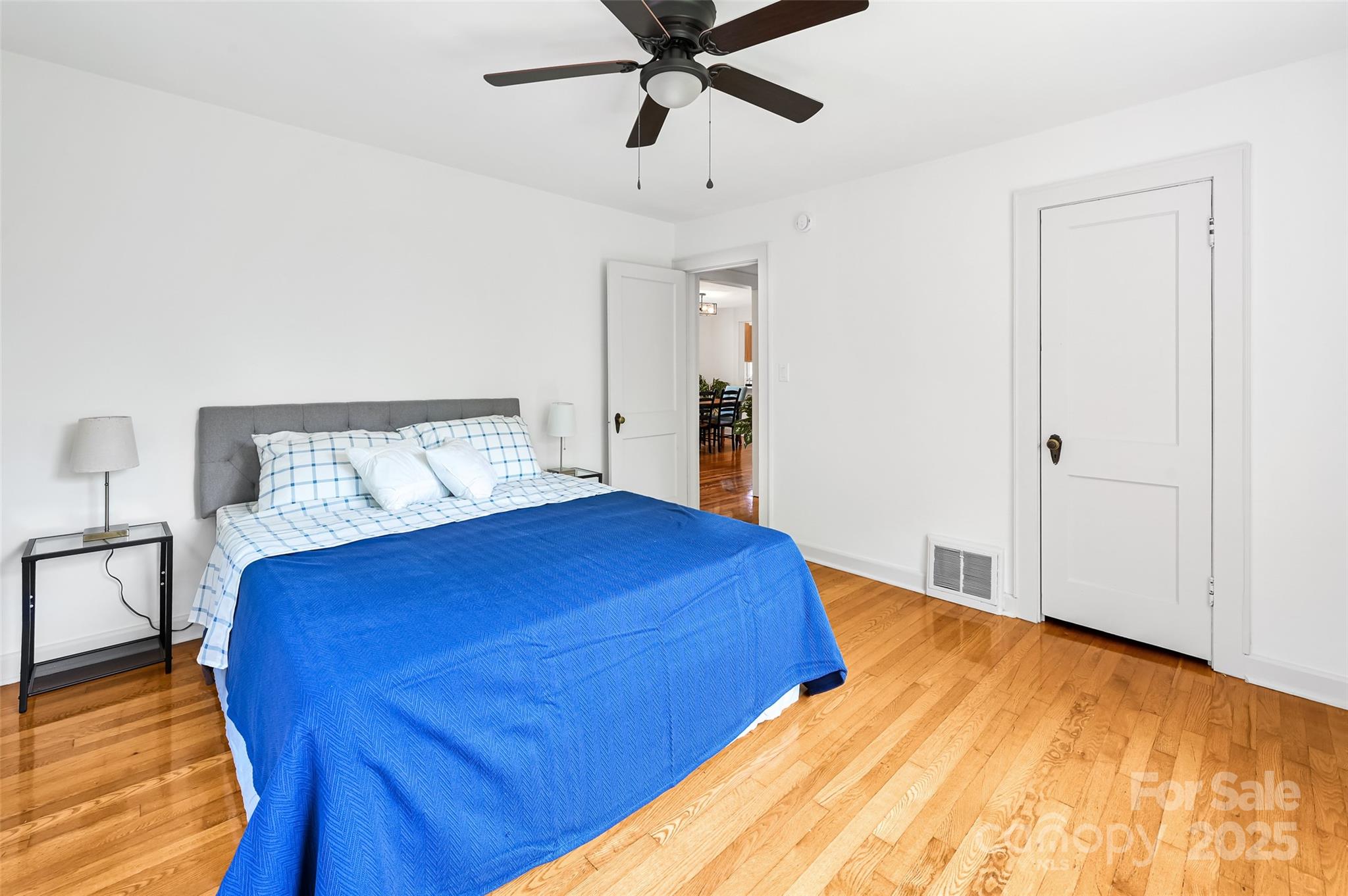 14 Monroe Street Brevard, NC 28712 - Photo 40 of 48 a bedroom with a bed and wooden floor