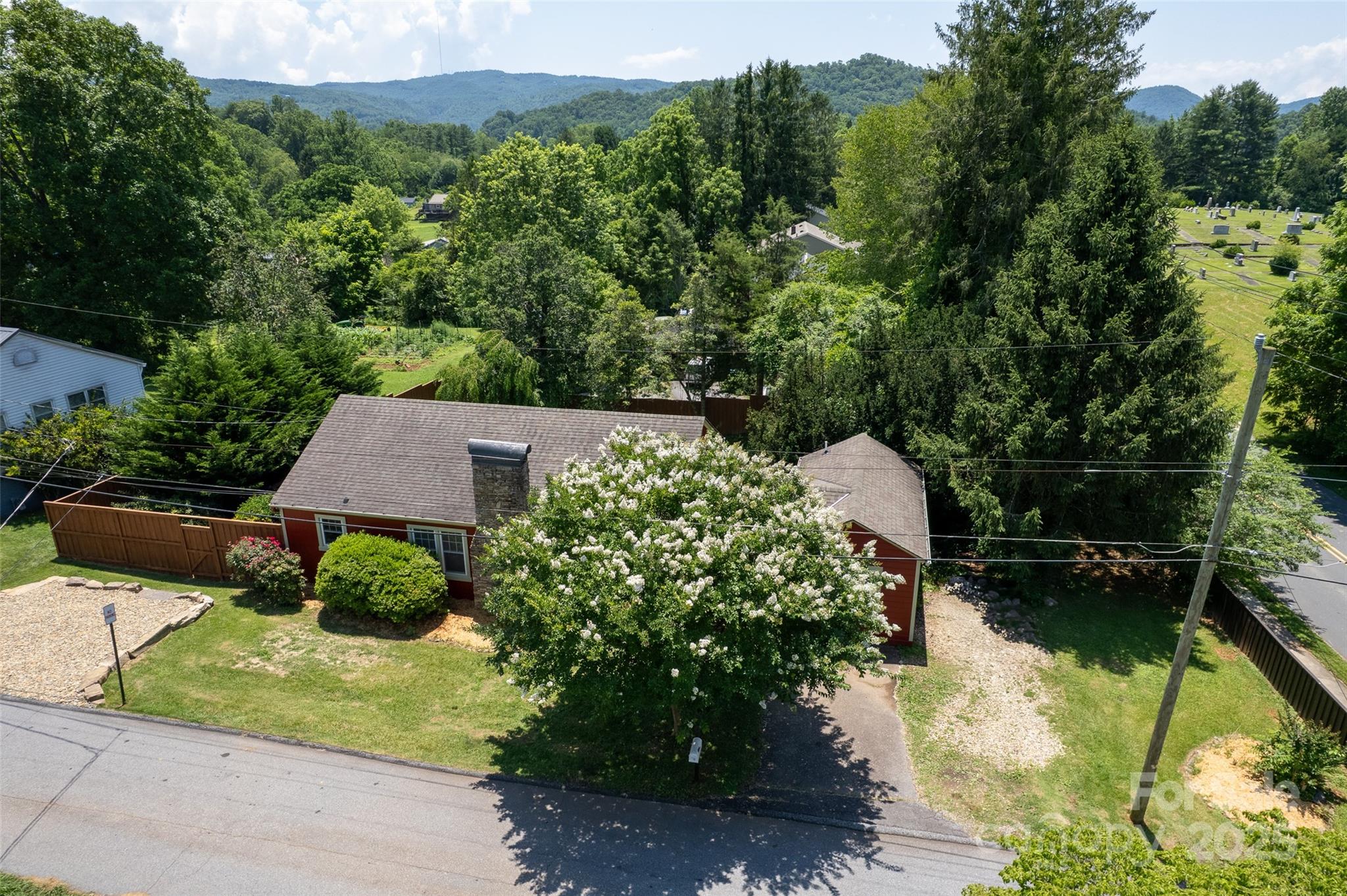 14 Monroe Street Brevard, NC 28712 - Photo 6 of 48 a aerial view of a house with a yard and lake view