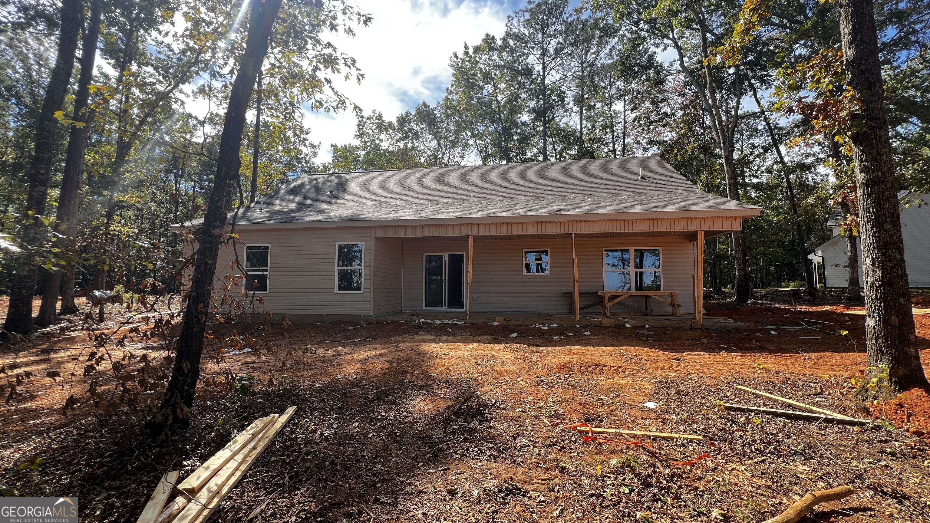 187 Coffey Road Barnesville, GA 30204 - Photo 19 of 27 a view of a house with a yard covered in snow