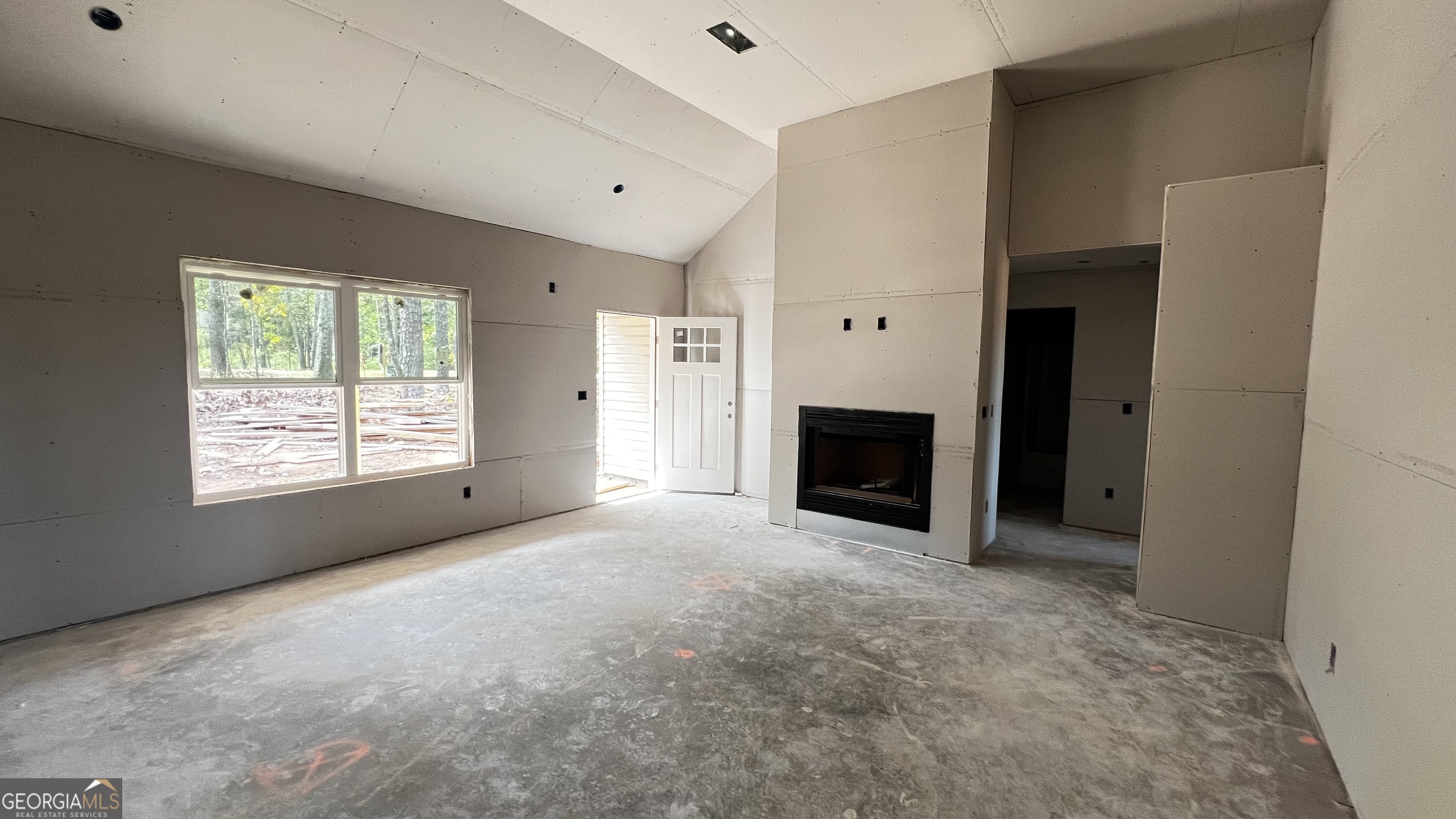187 Coffey Road Barnesville, GA 30204 - Photo 20 of 27 a view of empty room with a fireplace