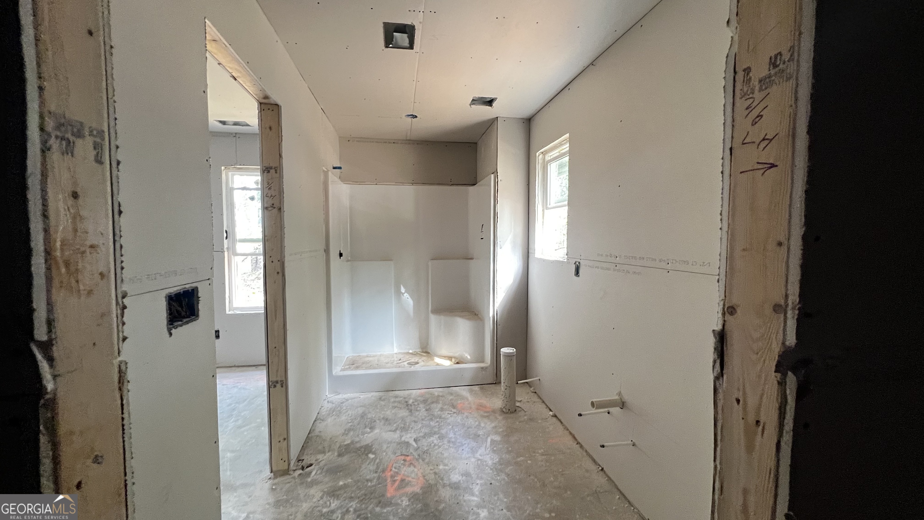 187 Coffey Road Barnesville, GA 30204 - Photo 25 of 27 a view of a bathroom with a shower and a sink