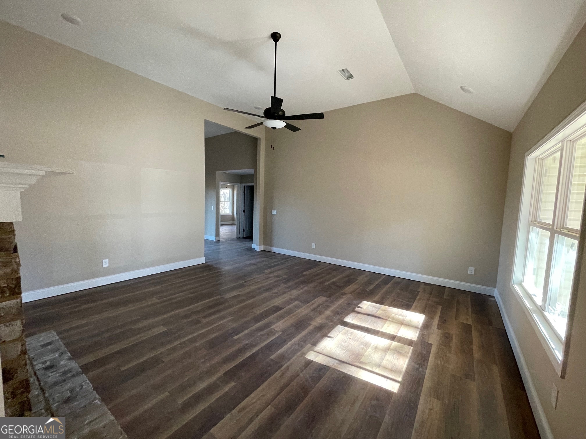 187 Coffey Road Barnesville, GA 30204 - Photo 4 of 27 wooden floor in an empty room with a window
