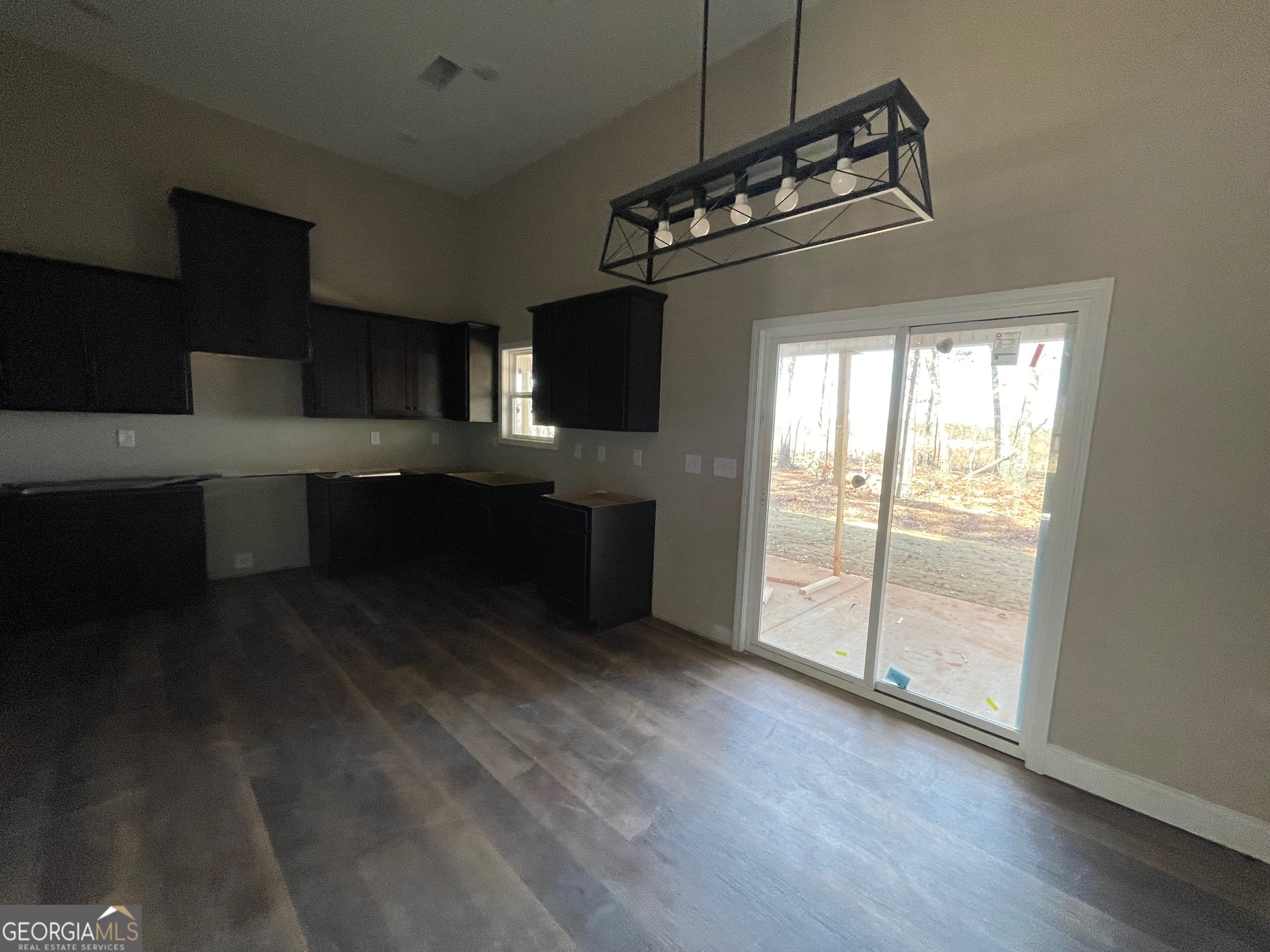 187 Coffey Road Barnesville, GA 30204 - Photo 7 of 27 a kitchen with kitchen island stainless steel appliances a counter space a sink and a window