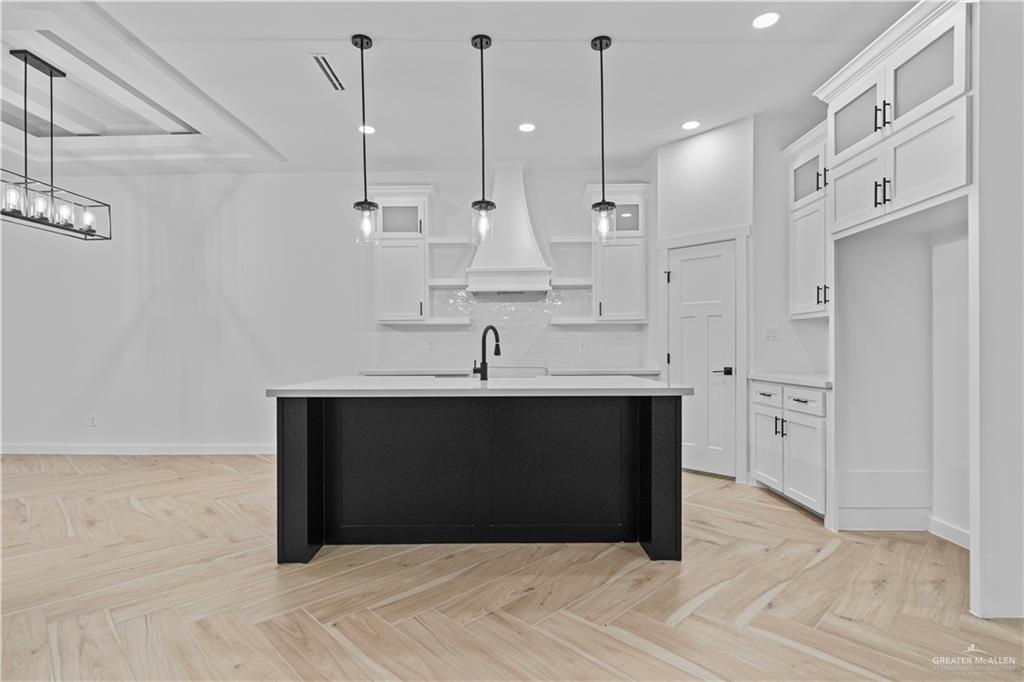 2728 East Conroe Road Edinburg, TX 78542 - Photo 3 of 14 a kitchen with stainless steel appliances granite countertop a sink and a refrigerator