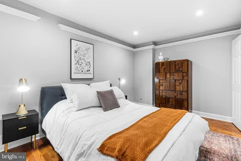 a bed room with a bed and a night stand