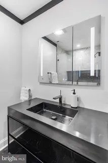 a kitchen with a sink cabinets and window