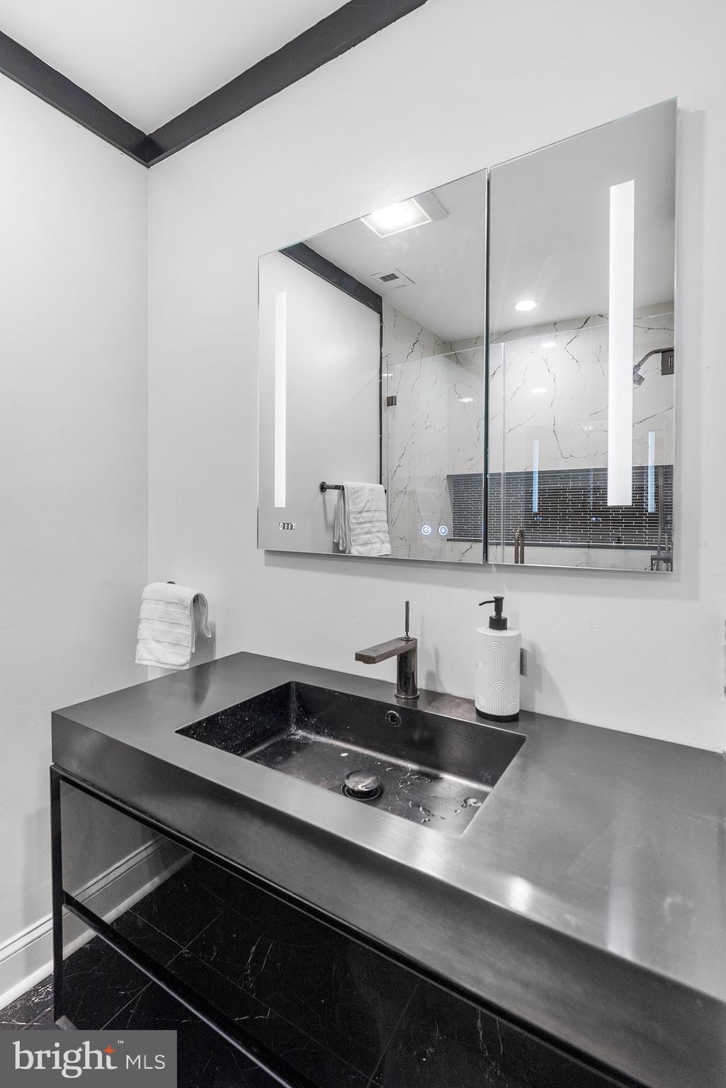 1903 Spruce Street, Unit 1A Philadelphia, PA 19103 - Photo 13 of 22 a kitchen with a sink cabinets and window